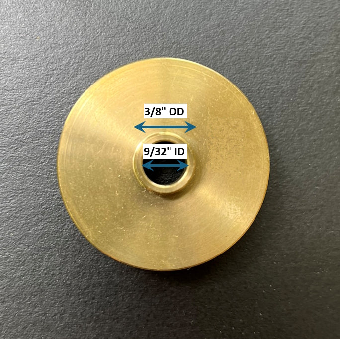 Brass washer with labeled dimensions on a dark background